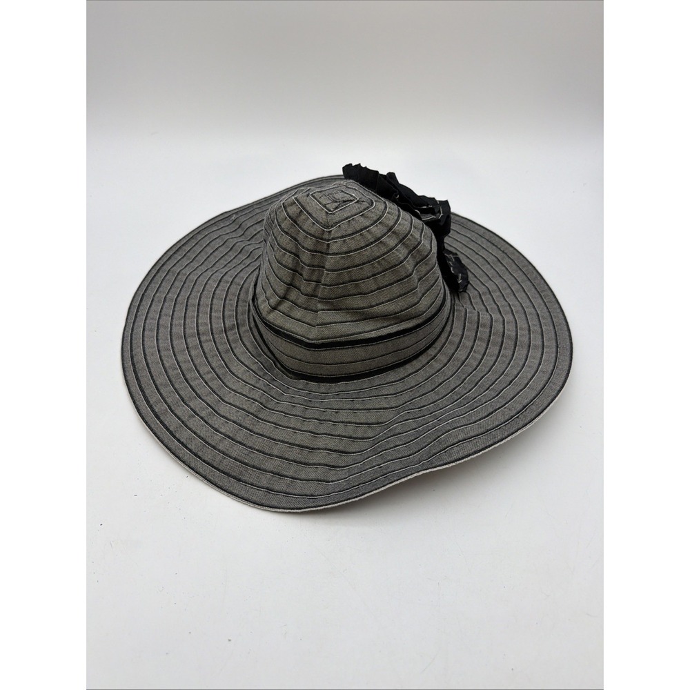 gray striped wide-brim sun hat adorned with two dark fabric